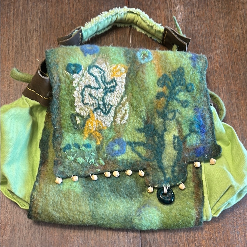 Artistic Green and Blue Backpack with Unique Design